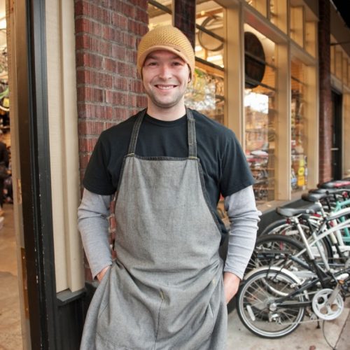 Portrait of Bike Mechanic Outside Store